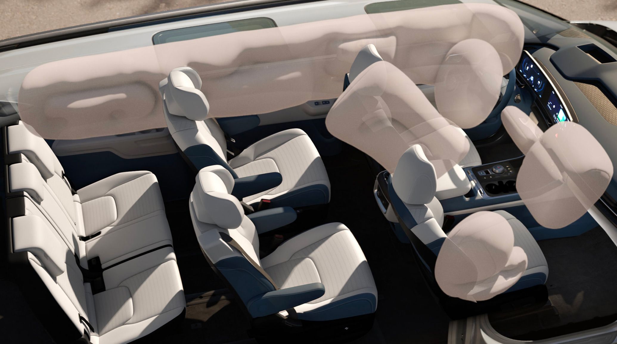 Top‑down view of the 2027 Kia Carnival Hybrid interior showing three rows of white seats and translucent overlays illustrating deployed airbags for safety feature visualization.