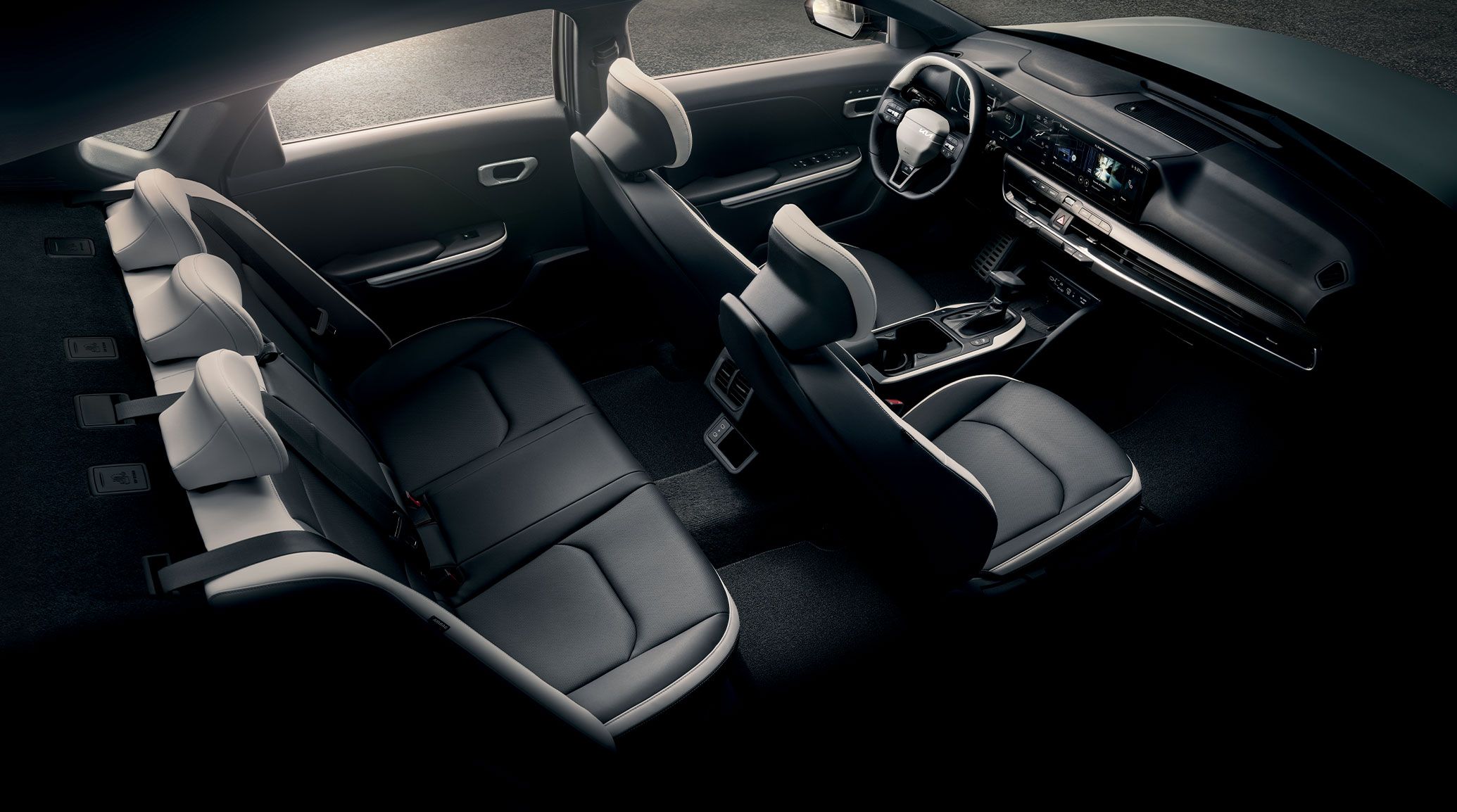 Interior overhead view of the 2026 Kia K4 sedan's accommodations, including ample legroom and headroom.