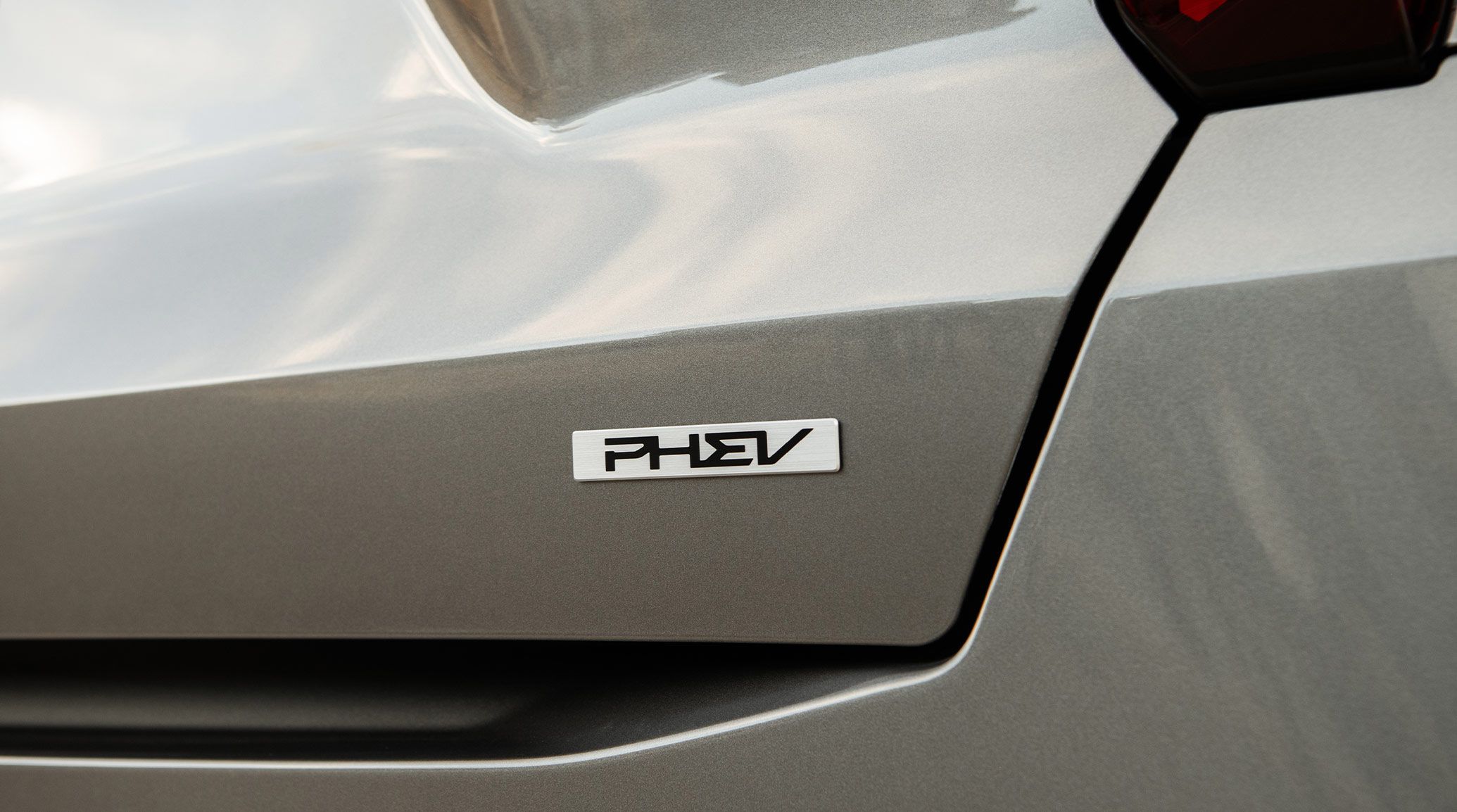 2026 Kia Sorento Plug-In Hybrid, zoomed in view of the PHEV emblem on the trunk