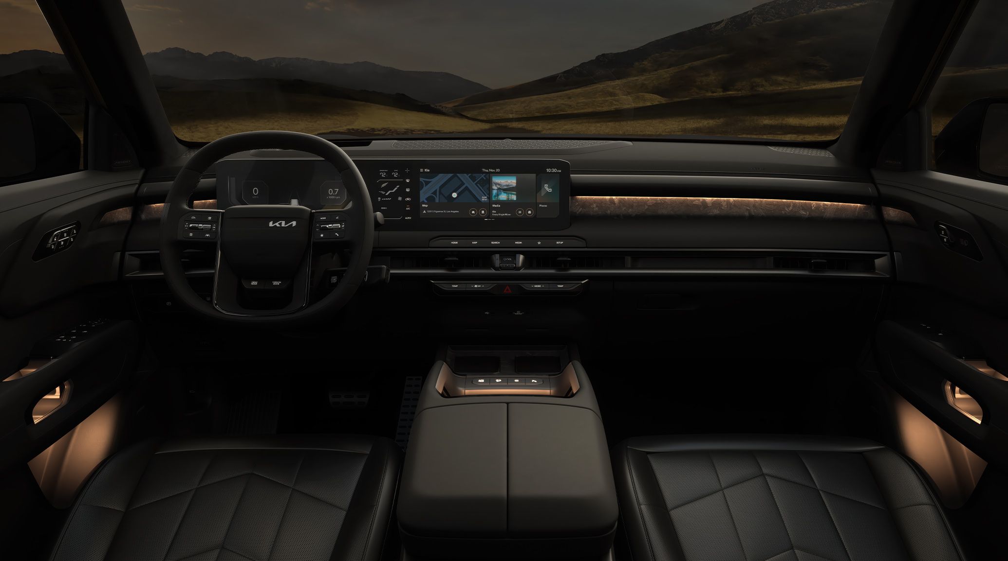 Interior view of 2027 Kia Telluride featuring a premium black cabin with ambient lighting, modern digital display, and a sleek center console, highlighting spacious front seats with lush mountains visible from the windshield.